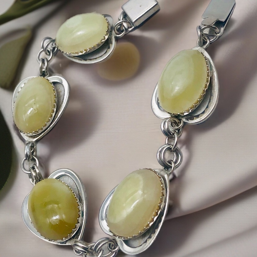 Rhodium Plated Bracelet with Pale Green Amber Cabochons